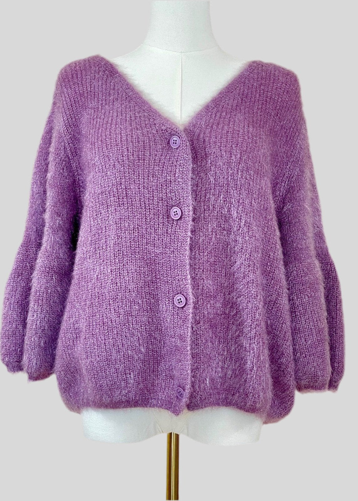 Front view of a lavender soft knit cardigan with button-front closure, oversized and fluffy design, showing voluminous sleeves