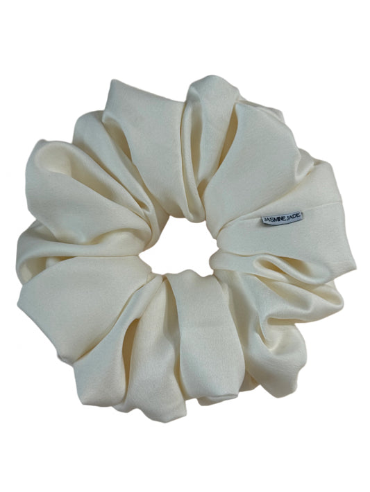 Jumbo ivory satin scrunchie with a matte finish, oversized for voluminous hairstyles, handmade in Texas