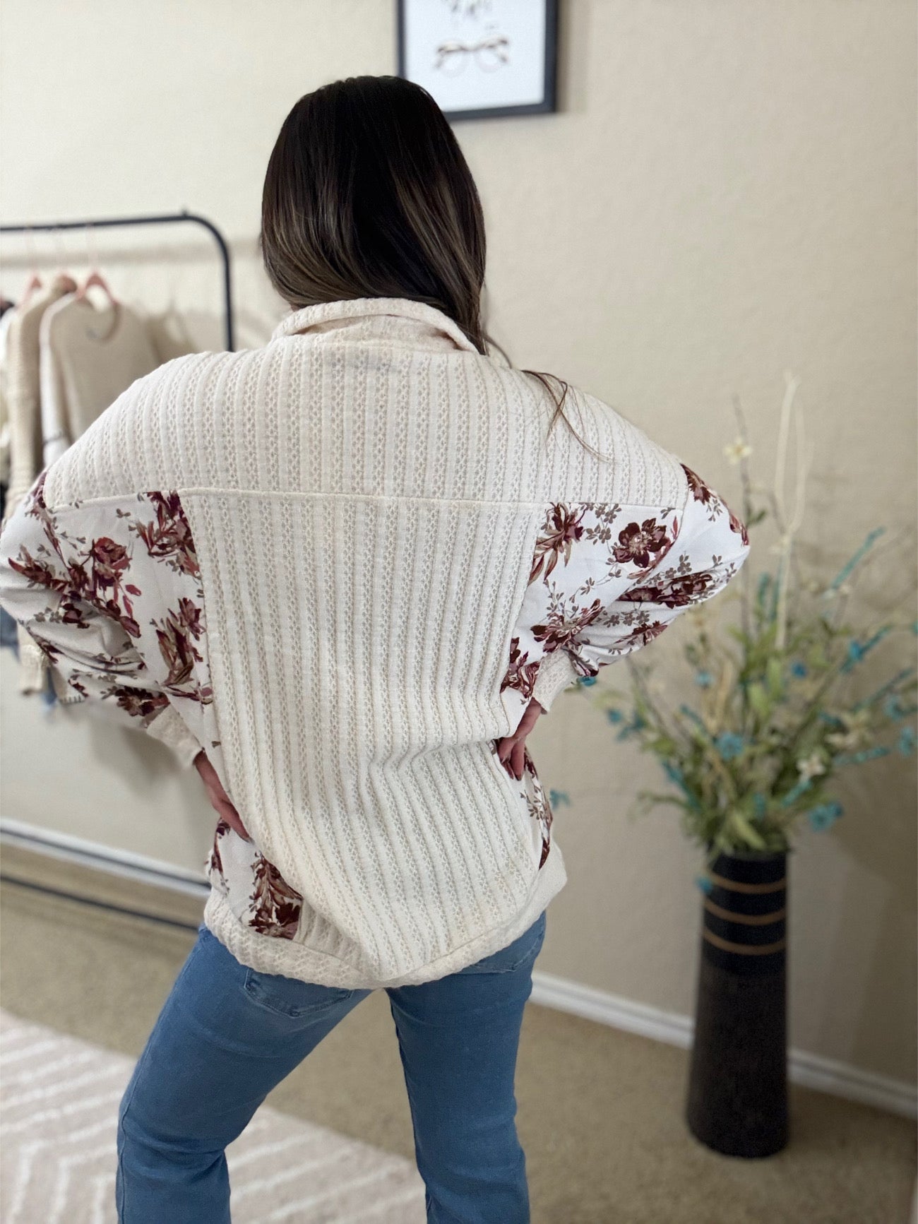 back view of the Lela Floral Drop Shoulder Brushed Knit Top with pockets, featuring a soft floral print and relaxed silhouette